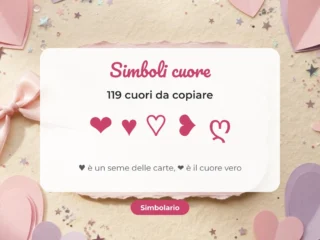 Simboli cuore da copiare ❤ ♥ ♡ su un biglietto bianco fra cuori di carta rosa e lilla
